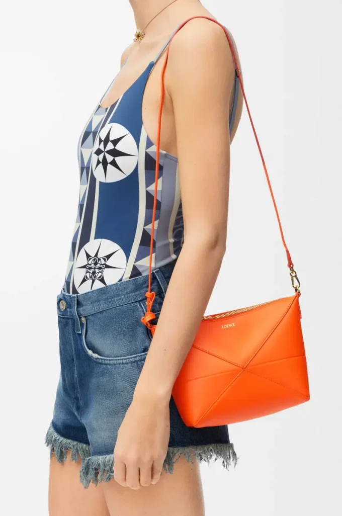 Bolsa Puzzle Fold en piel de becerro napa brillante Vivid Orange Bolsa Puzzle Fold en piel de becerro napa brillante Vivid Orange