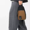 Bolso bandolera Flex en lona y ante Negro/Oro oscuro