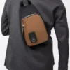 Bolso bandolera Flex en lona y ante Negro/Oro oscuro