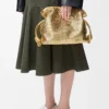 Bolso de mano Flamenco mediano en piel de cordero laminada Gold Bolso de mano Flamenco mediano en piel de cordero laminada Gold