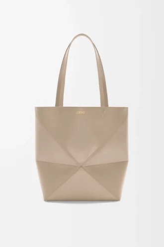Bolso mediano Puzzle Fold en piel de becerro brillante color arena