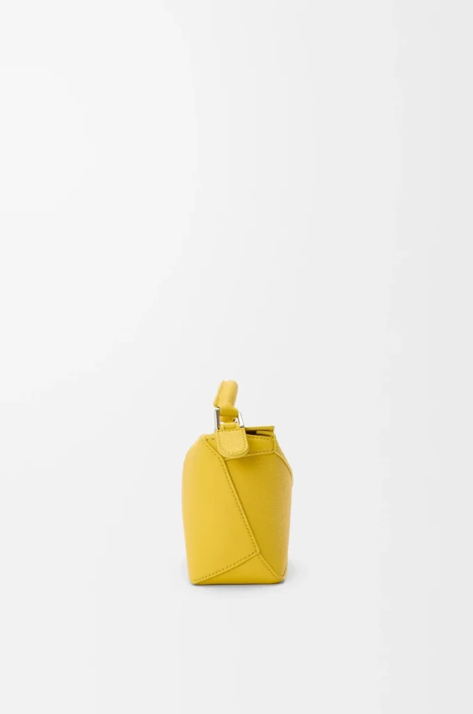 Bolso Mini Puzzle Edge en piel de becerro granulada suave color Dandelion Bolso Mini Puzzle Edge en piel de becerro granulada suave color Dandelion
