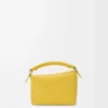 Bolso Mini Puzzle Edge en piel de becerro granulada suave color Dandelion Bolso Mini Puzzle Edge en piel de becerro granulada suave color Dandelion