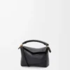 Bolso Mini Puzzle Edge en piel de becerro granulada suave, color negro