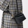 Bolso Mini Puzzle Edge en piel de becerro granulada suave, color negro