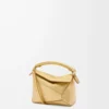 Bolso Mini Puzzle Edge en piel de cordero laminada dorada Bolso Mini Puzzle Edge en piel de cordero laminada dorada