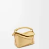 Bolso Mini Puzzle Edge en piel de cordero laminada dorada Bolso Mini Puzzle Edge en piel de cordero laminada dorada