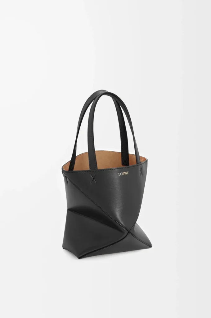 Bolso mini Puzzle Fold en piel de becerro brillante, color negro Bolso mini Puzzle Fold en piel de becerro brillante, color negro