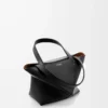 Bolso mini Puzzle Fold en piel de becerro brillante, color negro Bolso mini Puzzle Fold en piel de becerro brillante, color negro