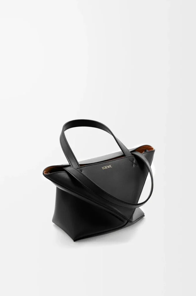 Bolso mini Puzzle Fold en piel de becerro brillante, color negro Bolso mini Puzzle Fold en piel de becerro brillante, color negro