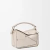 Bolso Panta pequeño Puzzle en piel de becerro brillante Light Ghost