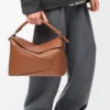 Bolso Puzzle Edge grande en piel de becerro clásica color tostado