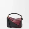 Bolso Puzzle pequeño en piel de becerro napa Negro/Burdeos Bolso Puzzle pequeño en piel de becerro napa Negro/Burdeos