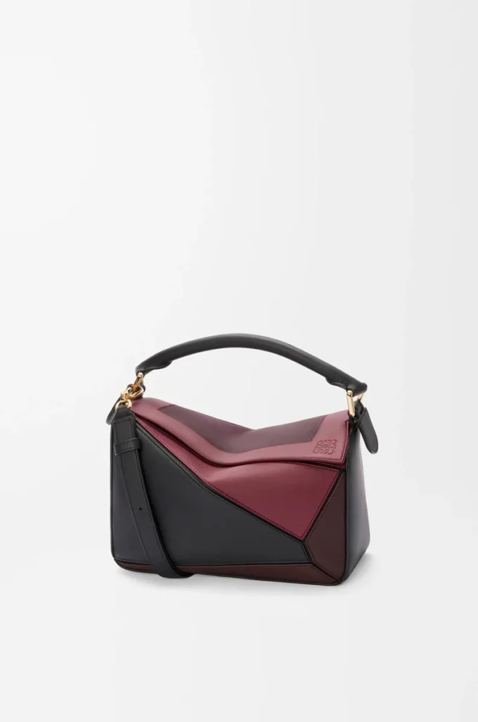 Bolso Puzzle pequeño en piel de becerro napa Negro/Burdeos Bolso Puzzle pequeño en piel de becerro napa Negro/Burdeos