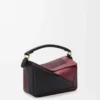 Bolso Puzzle pequeño en piel de becerro napa Negro/Burdeos Bolso Puzzle pequeño en piel de becerro napa Negro/Burdeos