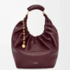 Bolso Squeeze mediano en piel de cordero napa suave Burdeos oscuro Bolso Squeeze mediano en piel de cordero napa suave Burdeos oscuro