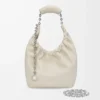 Bolso Squeeze pequeño en piel de cordero napa suave color sal marina Bolso Squeeze pequeño en piel de cordero napa suave color sal marina