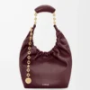 Bolso Squeeze pequeño en suave piel de cordero napa Burdeos oscuro Bolso Squeeze pequeño en suave piel de cordero napa Burdeos oscuro