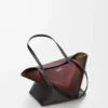 Bolso tote Puzzle Fold mediano en piel de becerro napa Negro/Burdeos Bolso tote Puzzle Fold mediano en piel de becerro napa Negro/Burdeos