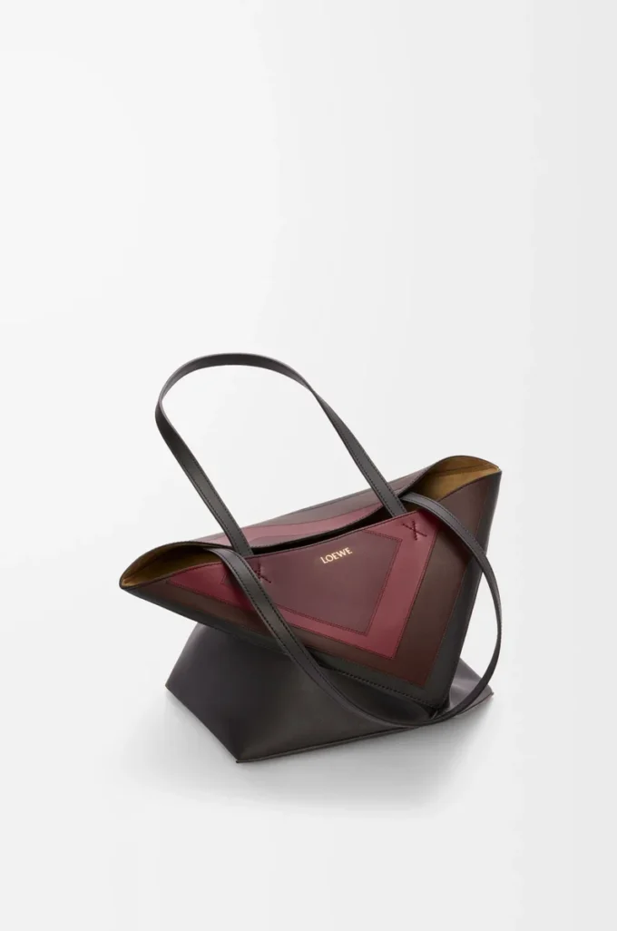 Bolso tote Puzzle Fold mediano en piel de becerro napa Negro/Burdeos Bolso tote Puzzle Fold mediano en piel de becerro napa Negro/Burdeos