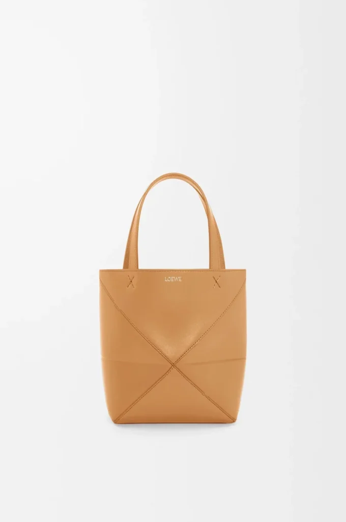 Bolso tote Puzzle Fold mini en piel de becerro brillante Warm Desert Bolso tote Puzzle Fold mini en piel de becerro brillante Warm Desert