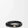 Brazalete tejido en latón y piel de becerro clásica. Negro Brazalete tejido en latón y piel de becerro clásica. Negro