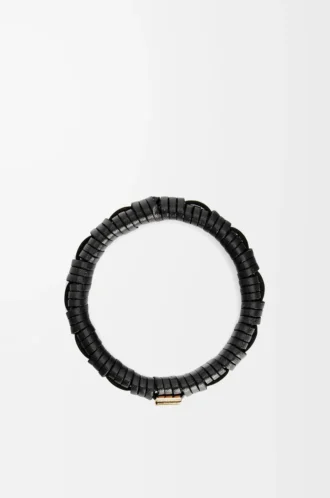 Brazalete tejido en latón y piel de becerro clásica. Negro
