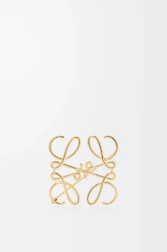 Broche Anagram en metal dorado