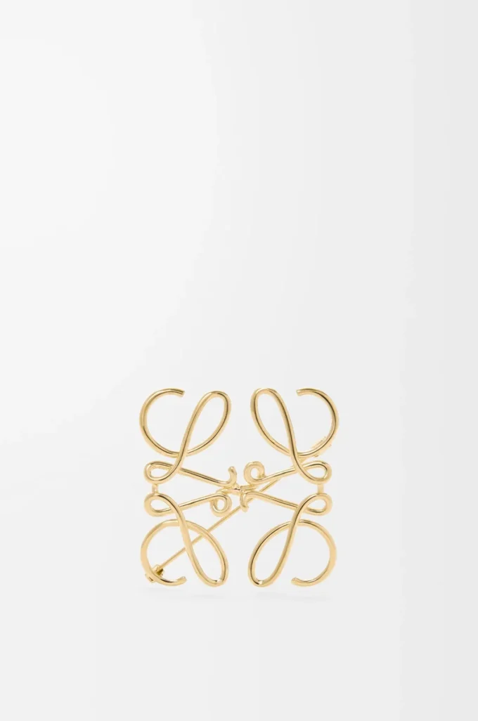 Broche Anagram en metal dorado Broche Anagram en metal dorado