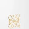 Broche Anagram en metal dorado Broche Anagram en metal dorado