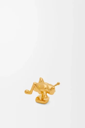 Broche de saltamontes en latón dorado