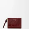 Cartera compacta con nudo en anguila burdeos oscuro Cartera compacta con nudo en anguila burdeos oscuro