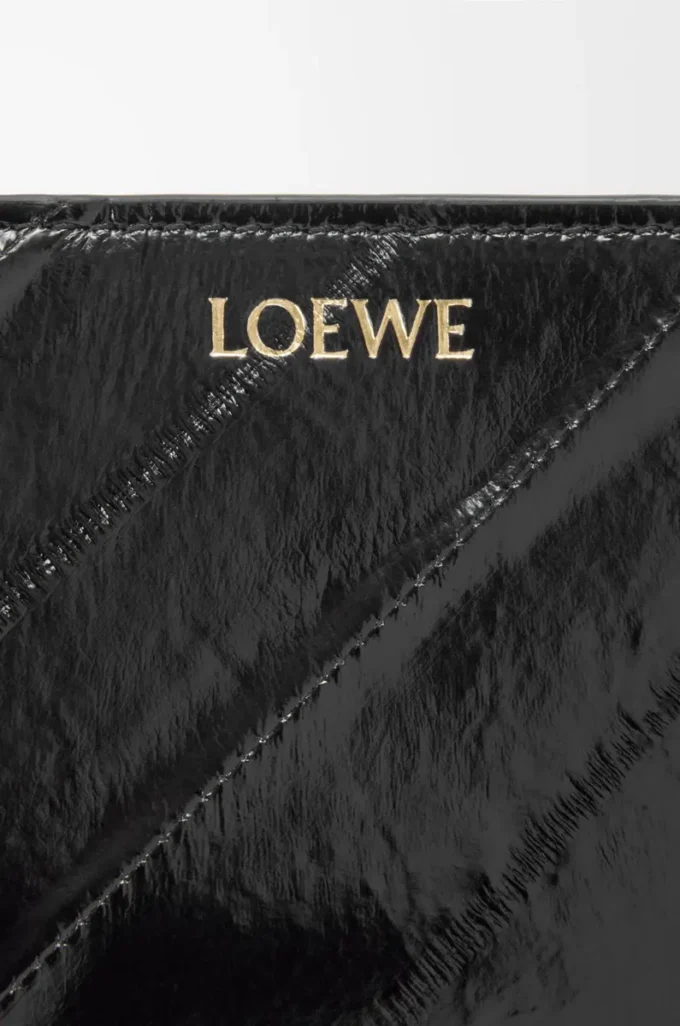 Cartera compacta Knot en piel de anguila negra Cartera compacta Knot en piel de anguila negra
