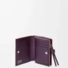 Cartera compacta Knot en piel de becerro napa brillante Clay/Plum Cartera compacta Knot en piel de becerro napa brillante Clay/Plum