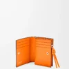 Cartera compacta Knot en piel de becerro napa brillante Negro/Naranja brillante Cartera compacta Knot en piel de becerro napa brillante Negro/Naranja brillante