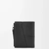 Cartera compacta y delgada Puzzle en piel de becerro granulada flexible. Negro