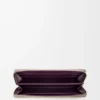 Cartera con cremallera y nudo en piel de becerro napa brillante Clay/Plum