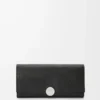 Cartera continental Pebble en piel de becerro mini grano. Negro Cartera continental Pebble en piel de becerro mini grano. Negro