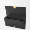 Cartera continental Pebble en piel de becerro napa brillante, color negro