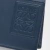Cartera plegable para monedas en piel de becerro satinada teñida en índigo