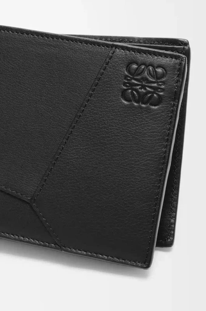 Cartera plegable Puzzle para monedas en piel de becerro clásica. Negro Cartera plegable Puzzle para monedas en piel de becerro clásica. Negro