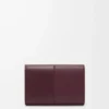 Cartera vertical pequeña en piel de becerro lisa y granulada Dark Burgundy