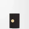 Cartera vertical pequeña Pebble en piel de becerro napa brillante Black