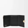 Cartera vertical pequeña Pebble en piel de becerro napa brillante Black