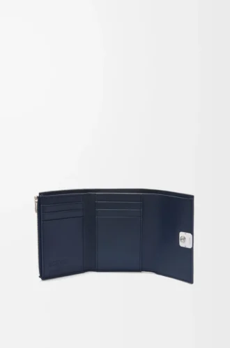 Cartera vertical pequeña Puffer Anagram en piel de becerro napa brillante azul marino oscuro