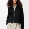 Chaqueta con capucha de piel de oveja negra Chaqueta con capucha de piel de oveja negra