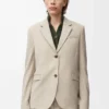 Chaqueta entallada de lana melange beige claro Chaqueta entallada de lana melange beige claro