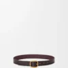 Cinturón suave y redondeado en piel de becerro granulada y flexible Oxblood/Vintage Gold Cinturón suave y redondeado en piel de becerro granulada y flexible Oxblood/Vintage Gold