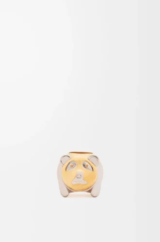 Dado pequeño con forma de animal en metal dorado/paladio