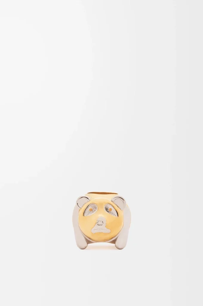 Dado pequeño con forma de animal en metal dorado/paladio